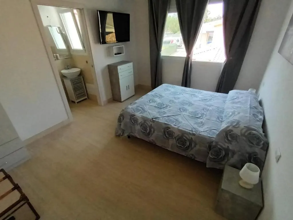 Quarto em Acomodações Particulares La Fenice Budoni Itália